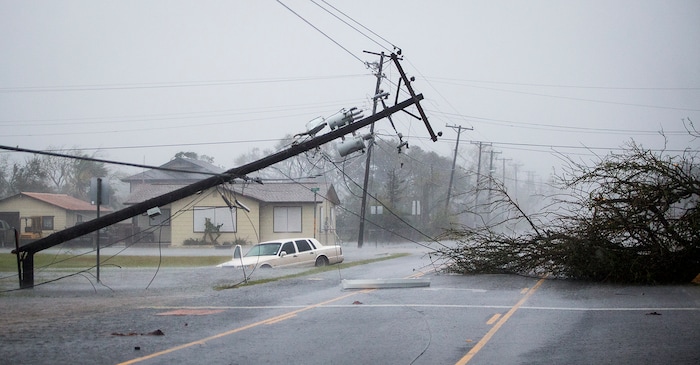 (Nick Wagner | Austin American-Statesman via AP) A vehicle sits in standing water after Hurricane Harvey ripped through Rockport, Texas, on Saturday, Aug. 26, 2017.  The fiercest hurricane to hit the U.S. in more than a decade spun across hundreds of miles of coastline where communities had prepared for life-threatening storm surges, walls of water rushing inland.