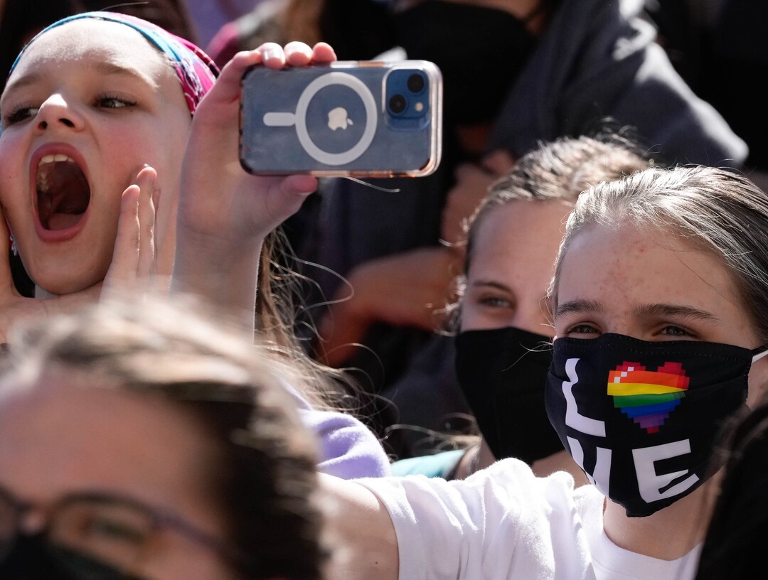 (Francisco Kjolseth | The Salt Lake Tribune) Students yell in support as speakers use a megaphone to address the crowd at West High School during a staged a walkout on Wednesday, April 6, 2022 to protest HB11, which bans transgender girls from participating in female school sports.