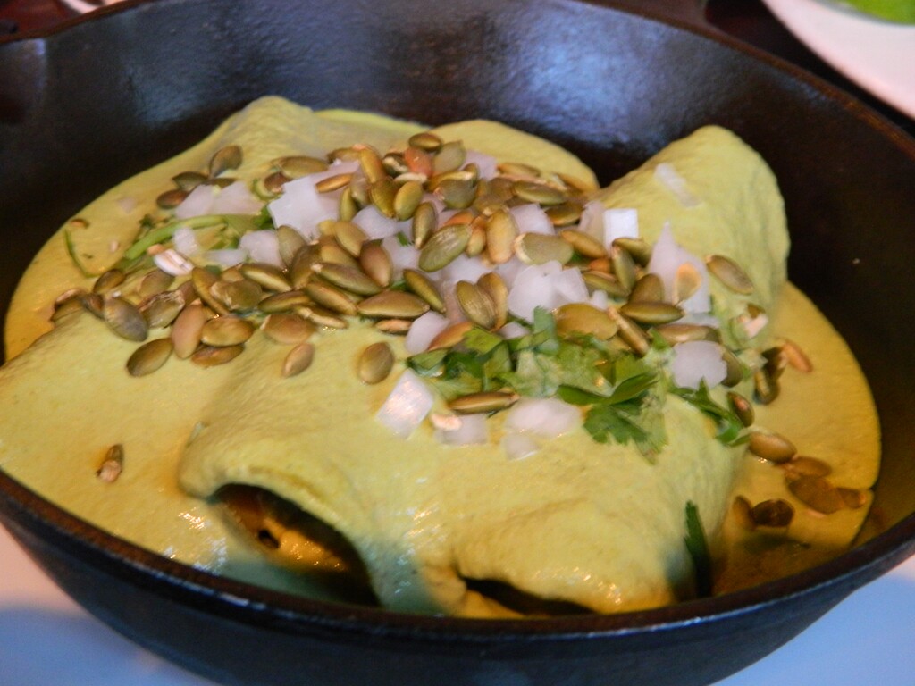 An order of three chicken enchiladas with a green chile and pumpkin seed salsa at Alamexo Cantina.