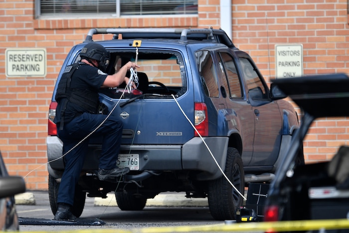 Police investigate the scene outside the Burnette Chapel Church of Christ after a deadly shooting at the church on Sunday, Sept. 24, 2017, in Antioch, Tenn. (Andrew Nelles/The Tennessean via AP)