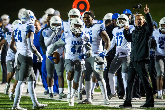 (Chris Detrick  |  The Salt Lake Tribune)  IMG Academy's Brendan Radley-Hiles (44) celebrates after intercepting the ball during the game at East High School Friday, October 20, 2017. 