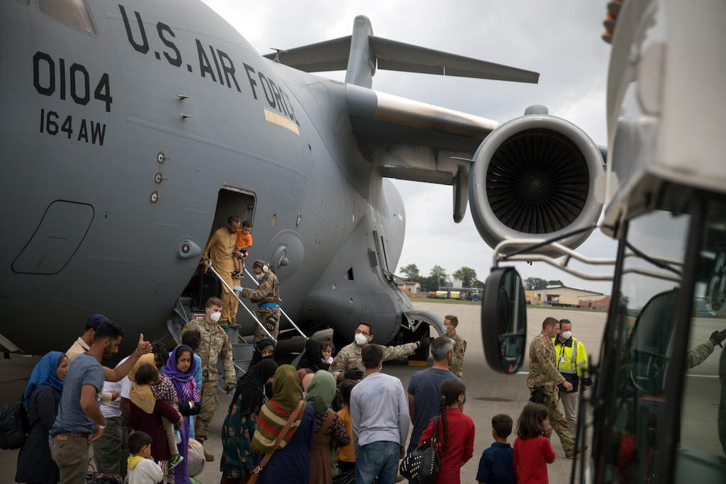 (Gordon Welters | The New York Times) A C-17 aircraft arrives with some of the final people evacuated from Afghanistan, at Ramstein Air Base in Germany, Monday, Aug. 30, 2021.