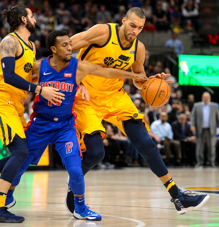 (Steve Griffin  |  The Salt Lake Tribune)  Utah Jazz center Rudy Gobert (27) dribbles past Detroit Pistons guard Ish Smith (14) during the Utah Jazz versus Detroit Pistons at Vivint Smart Home Arena in Salt Lake City Tuesday March 13, 2018.