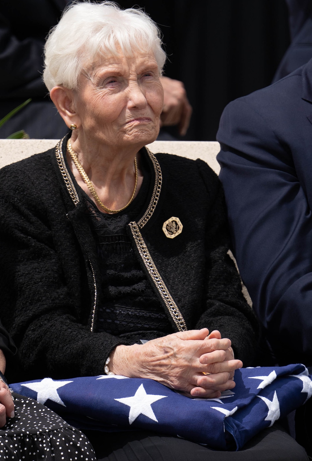 (Francisco Kjolseth | The Salt Lake Tribune) Elaine Hatch, widow of of former U.S. Sen. Orrin Hatch, is presented with the flag that covered her husband’s casket, following funeral services at the The Church of Jesus Christ of Latter-day Saints Institute of Religion in Salt Lake City on Friday, May 6, 2022. Hatch, the longest-serving Republican senator in U.S. history and the longest-serving from Utah, died April 23 at age 88.