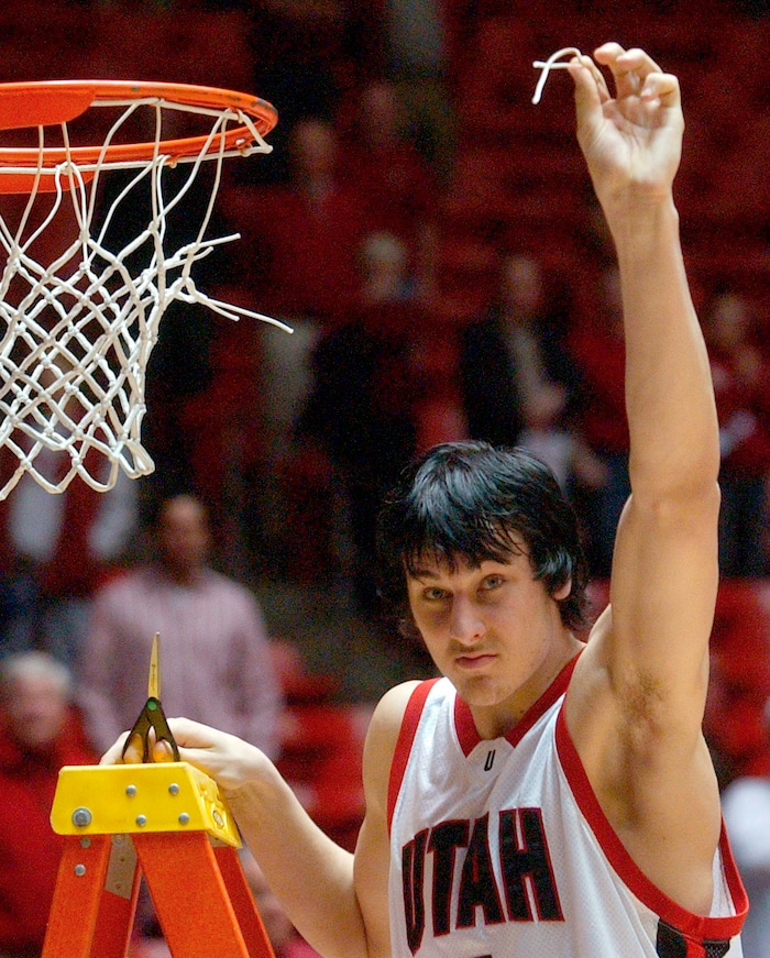 Andrew Bogut holds up a piece of the net after the game,  BYU vs Utah at the Huntsman Center Saturday afternoon.  photo by Rick Egan