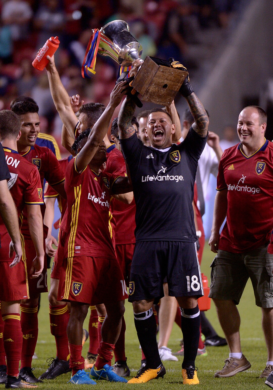 (Leah Hogsten  |  The Salt Lake Tribune) Real Salt Lake goalkeeper Nick Rimando (18) hoists up the Rocky Mountain Cup with the team. Real Salt Lake defeated the Colorado Rapids 4-1 for the Rocky Mountain Cup at Rio Tinto Stadium, Saturday, August 26, 2017. 