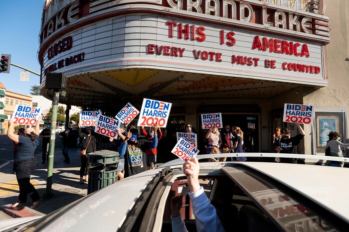 People celebrate the victory of President-elect Joe Biden and Vice President-elect Kamala Harris in Oakland, Calif., on Saturday, Nov. 7, 2020.   Biden defeated President Donald Trump to become the 46th president of the United States on Saturday, positioning himself to lead a nation gripped by the historic pandemic and a confluence of economic and social turmoil. (AP Photo/Noah Berger)