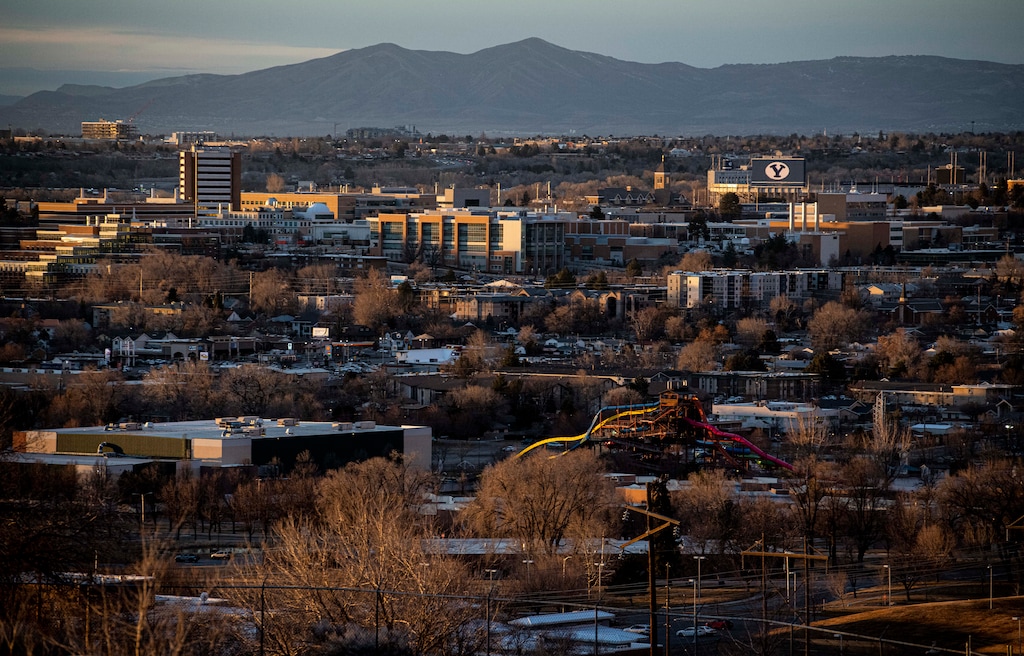 (Isaac Hale | Special to The Tribune) The sun sets on the campus of Brigham Young University and the surrounding area in Provo as seen from Slate Canyon Park on Monday, Feb. 14, 2022. Revere Health is planning to lay off 177 Provo workers this fall.