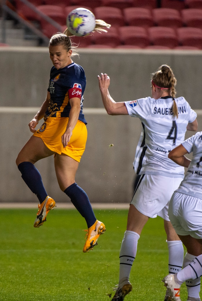 (Rick Egan | The Salt Lake Tribune) Utah Royals FC forward Amy Rodriguez (8) heads the ball as Portland Thorns FC defender Becky Sauerbrunn (4) defender Becky Sauerbrunn (4) defends, in soccer action between Utah Royals FC and Portland Thorns FC at Rio Tinto Stadium, on Saturday, Oct. 3, 2020.