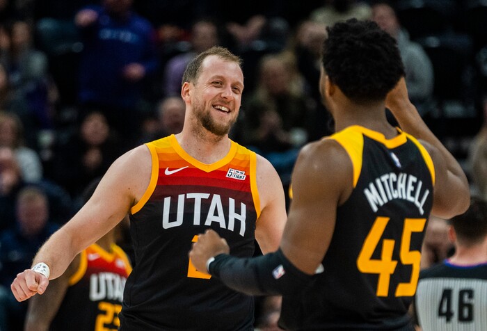 (Rick Egan | The Salt Lake Tribune) Utah Jazz guard Joe Ingles (2) celebrates with Donovan Mitchell (45) after Mitchell hit a big shot for the Jazz with 2:50 remaining the the game, in NBA action between the Utah Jazz and the Washington Wizards, at Vivint Arena on Saturday, Dec. 18, 2021.