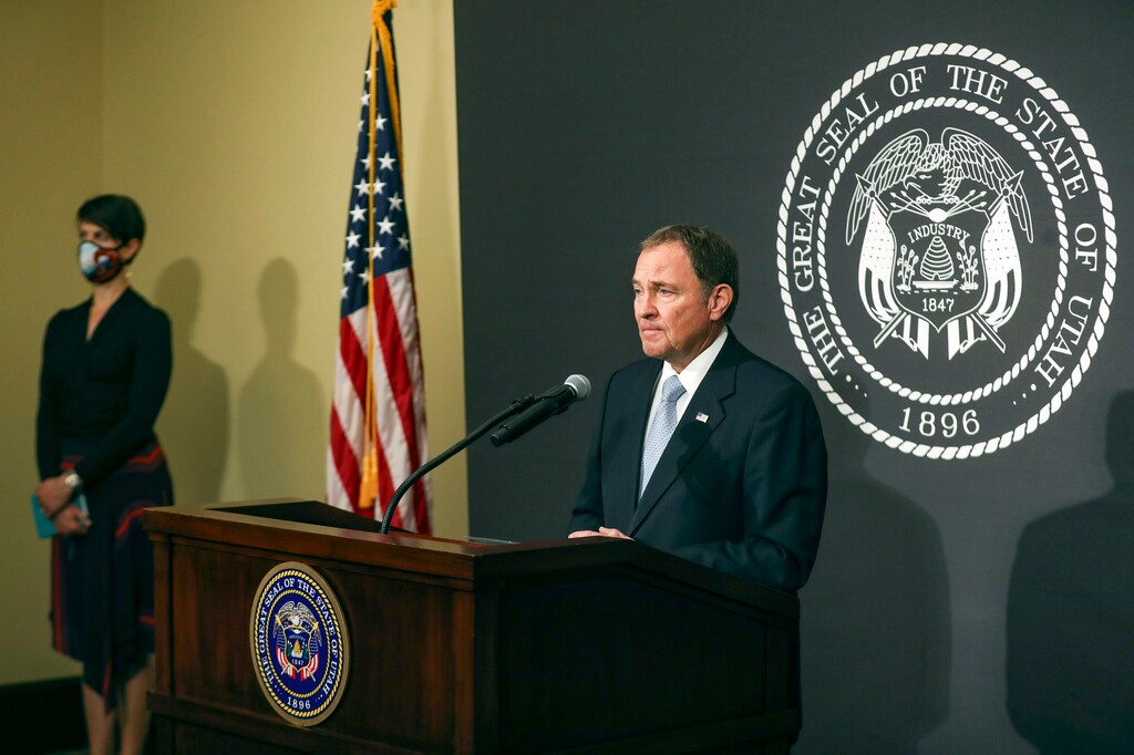 (Steve Griffin | Deseret News, pool) Gov. Gary Herbert listens to a question as he stands with Dr. Angela Dunn, state epidemiologist with the Utah Department of Health, during the daily COVID-19 briefing at the Capitol in Salt Lake City on Wednesday, May 20, 2020.