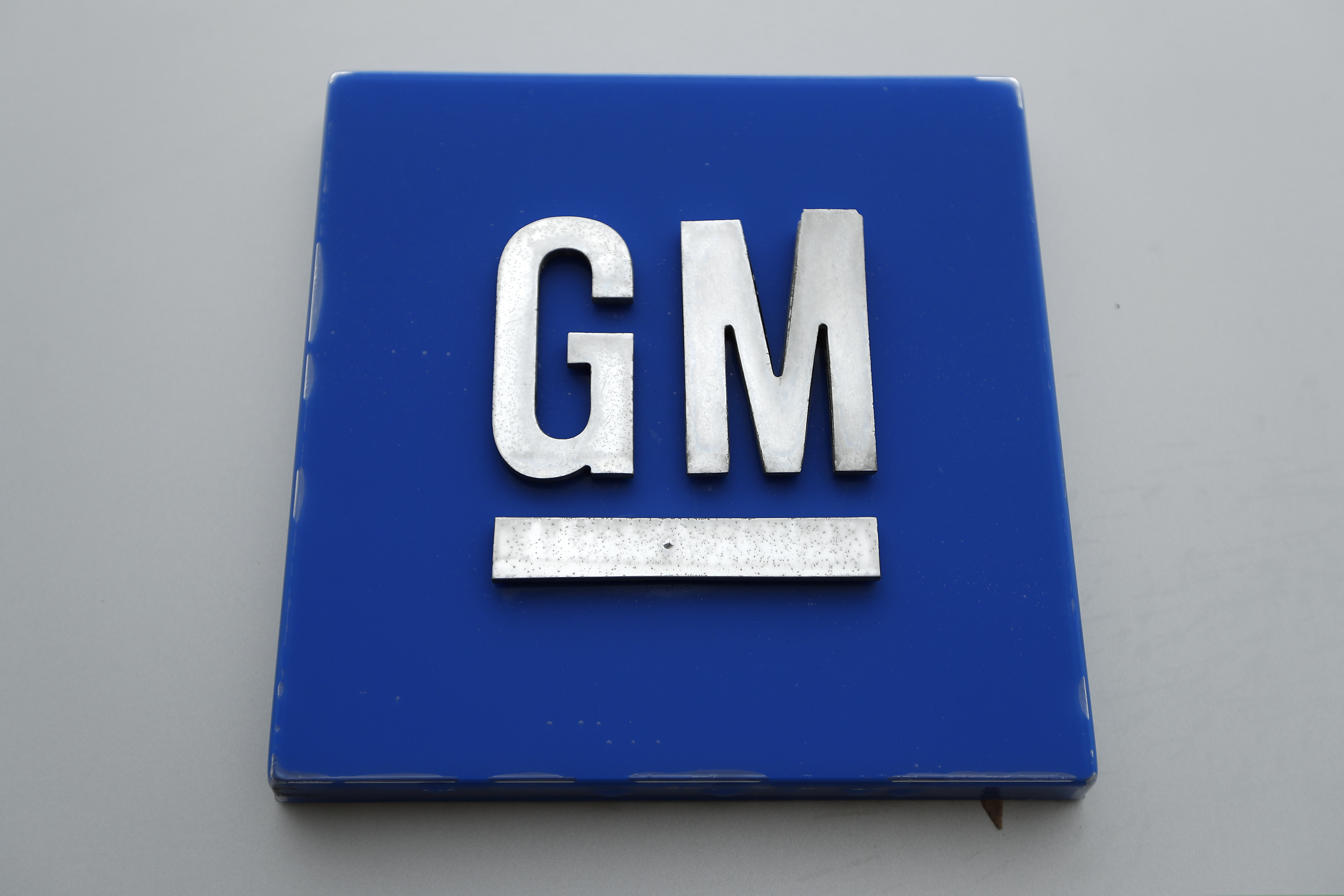 FILE - This Jan. 27, 2020, file photo shows a General Motors logo at the General Motors Detroit-Hamtramck Assembly plant in Hamtramck, Mich.  (AP Photo/Paul Sancya, File)