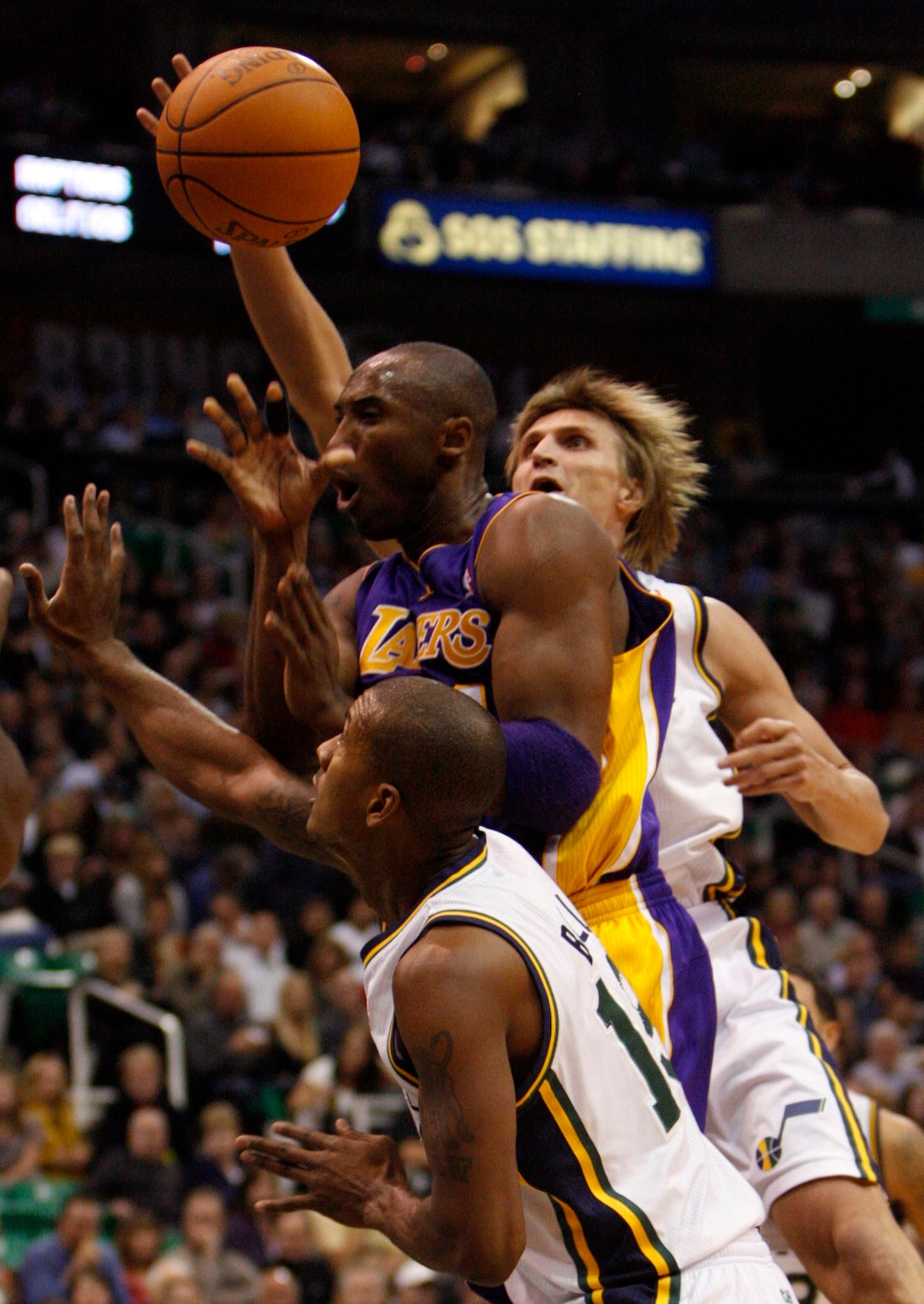 (Trent Nelson  |  The Salt Lake Tribune) Utah Jazz forward Andrei Kirilenko (47) and Utah Jazz guard Raja Bell (19) knock the ball away from Los Angeles Lakers guard Kobe Bryant (24). Utah Jazz vs. Los Angeles Lakers, NBA basketball Friday, November 26, 2010 at EnergySolutions Arena.