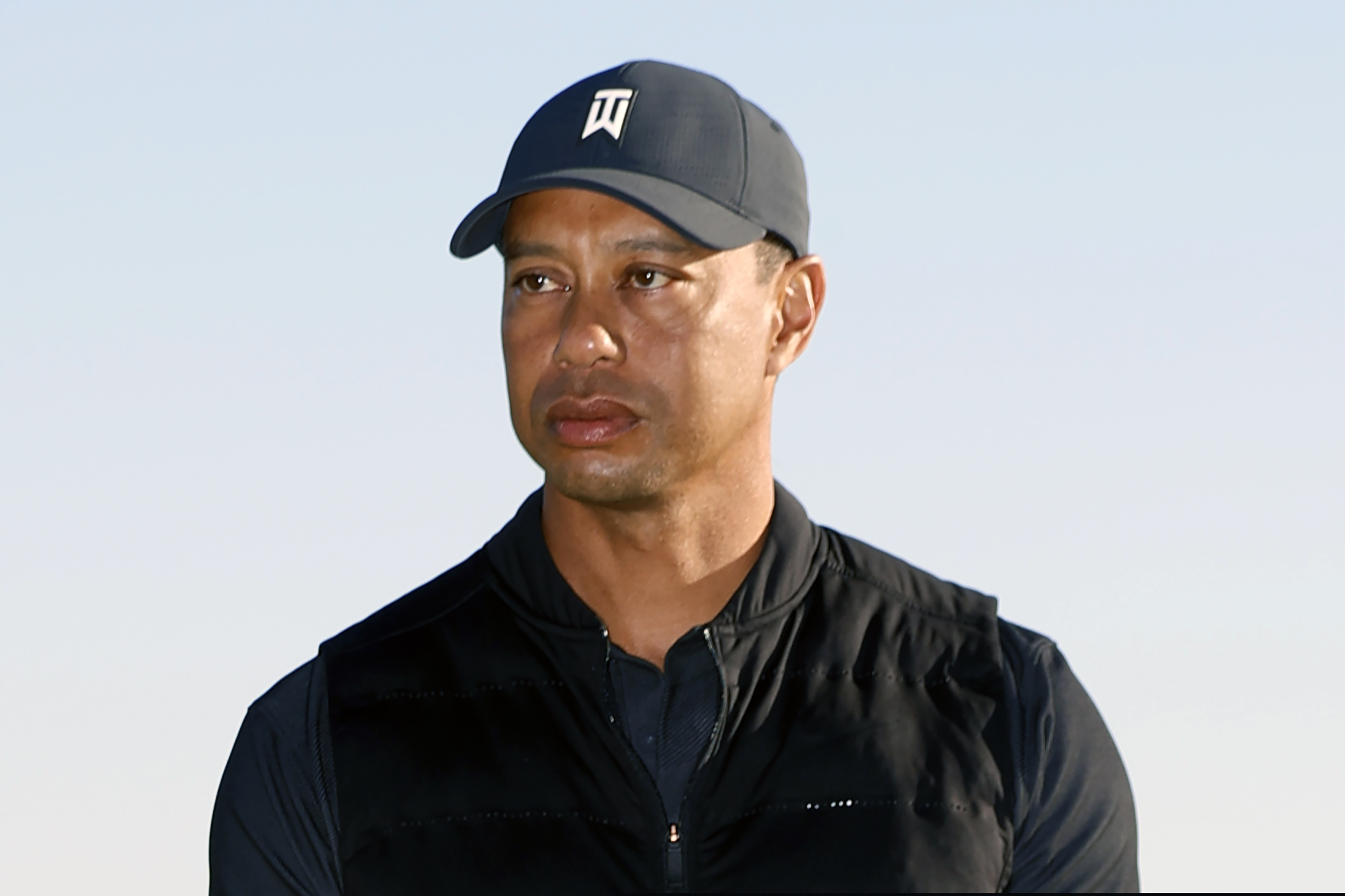(Ryan Kang | AP) Tiger Woods looks on during the trophy ceremony on the practice green after the final round of the Genesis Invitational golf tournament at Riviera Country Club, Sunday, Feb. 21, 2021, in the Pacific Palisades area of Los Angeles. Woods was injured Tuesday, Feb. 23, 2021, in a vehicle rollover in Los Angeles County and had to be extricated from the vehicle with the “jaws of life” tools, the Los Angeles County Sheriff’s Department said.