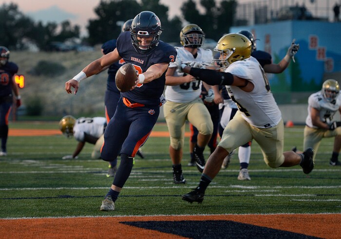(Scott Sommerdorf   |  The Salt Lake Tribune)   
Brighton QB Alexander Zettler pushes the ball across the goal line, but the TD was called back due to holding and the Bengals settled for a field goal for a brief 10-7 lead during first half play. Skyline held a 14-10 lead at the half over Brighton, Friday, September 15, 2017.