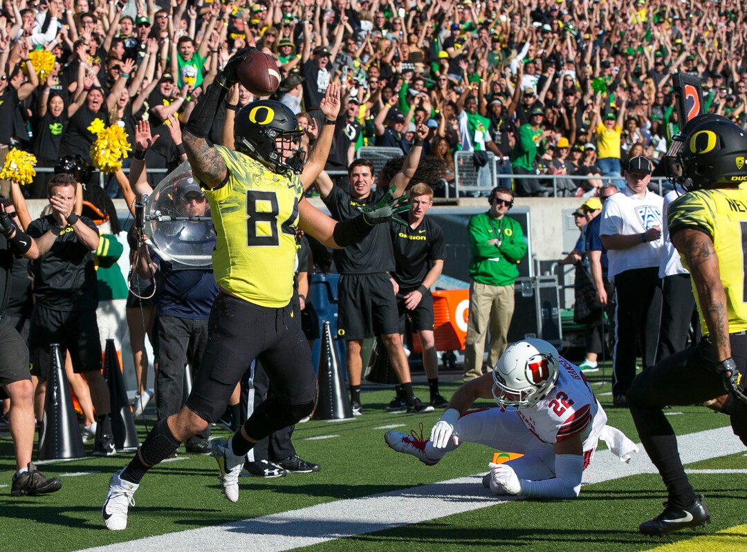 Oregon tight end Cam McCormick, left, celebrates a first quarter touchdown against Utah in an NCAA college football game Saturday, Oct. 28, 2017, in Eugene, Ore. (AP Photo/Chris Pietsch)