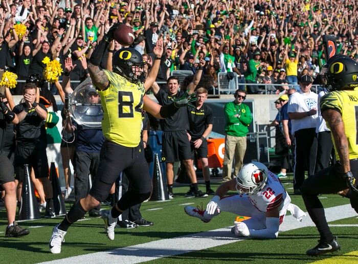 Oregon tight end Cam McCormick, left, celebrates a first quarter touchdown against Utah in an NCAA college football game Saturday, Oct. 28, 2017, in Eugene, Ore. (AP Photo/Chris Pietsch)