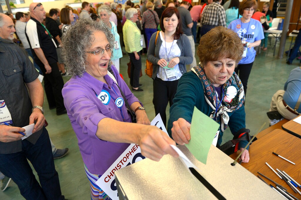 (Leah Hogsten | Tribune file photo)
l-r Carol Evans of Taylorsville and Jan Ferre of Salt Lake City cast their ballots for candidates at the Salt Lake County Democratic convention, Saturday, April 12, 2014, at West Jordan Middle School.
