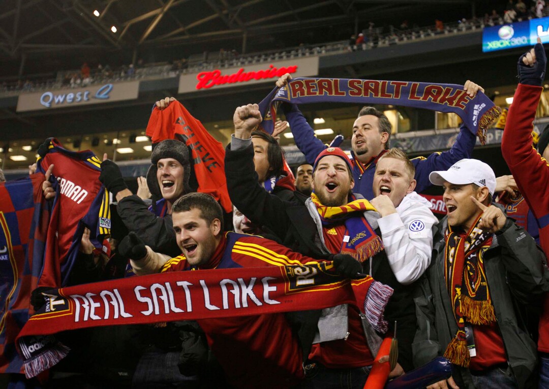(Trent Nelson  |  Tribune file photo) RSL fans celebrate the team's win on Sunday. RSL won the MLS Cup 5-4 during the penalty round.