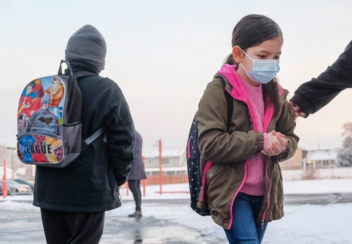 (Leah Hogsten | The Salt Lake Tribune) Escalante Elementary first grader Fatima Brito, 7, heads into the classroom in Salt Lake City, January, 25, 2021. Salt Lake City School District reopened all of the district's elementary schools to in-person learning on Monday. It is the first time students in kindergarten through sixth grade are back in the classroom for a full day of school since they first closed for the pandemic in March 2020.