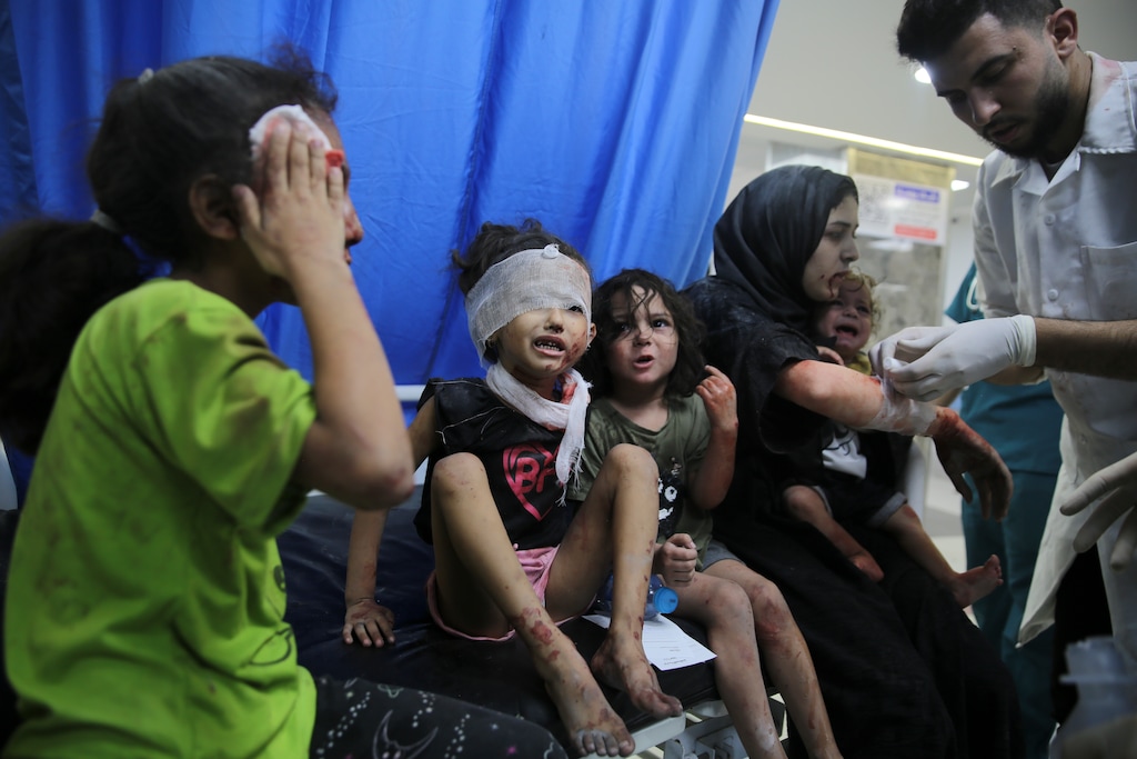 (Ali Mahmoud | AP) Palestinian children wounded in Israeli strikes are brought to Shifa Hospital in Gaza City on Wednesday, Oct. 11, 2023.