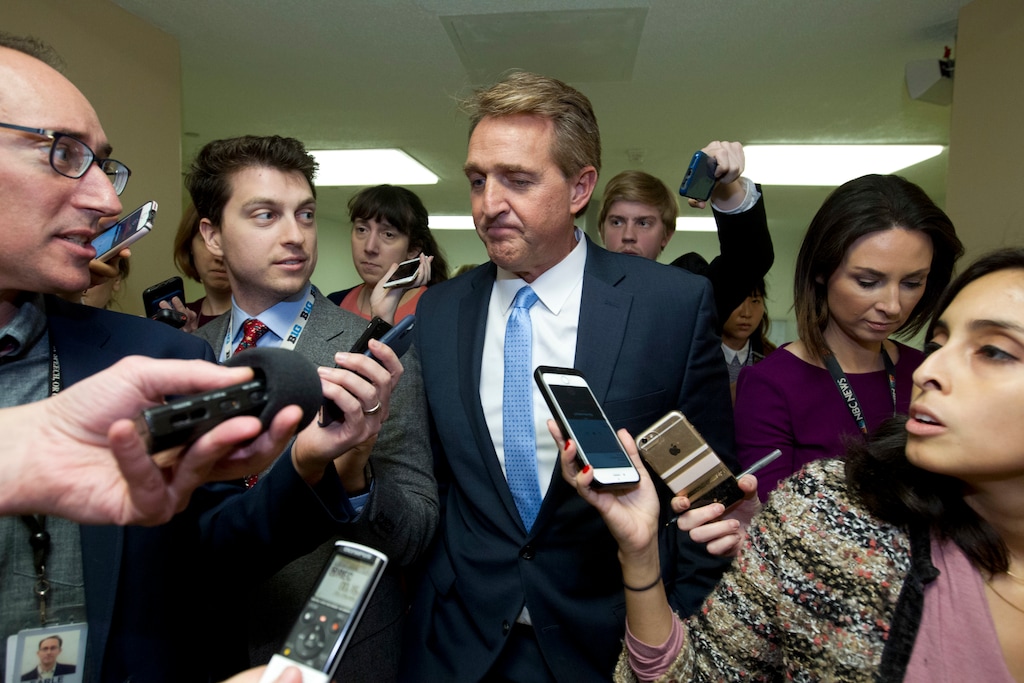 (AP Photo/Jose Luis Magana) Sen. Jeff Flake, R-Ariz., a member of the Senate Foreign Relations Committee, speaks with reporters on his way to the senate chamber, as the Senate takes up a House-passed bill that would pay for President Donald Trump's border wall and avert a partial government shutdown, at the Capitol in Washington, Friday, Dec. 21, 2018.