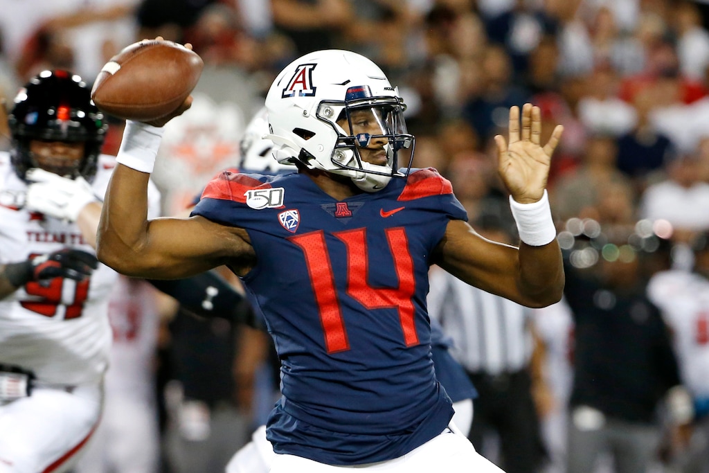 Arizona quarterback Khalil Tate (14) throws a pass against Texas Tech during the first half of an NCAA college football game Saturday, Sept. 14, 2019, in Tucson, Ariz. (AP Photo/Ralph Freso)