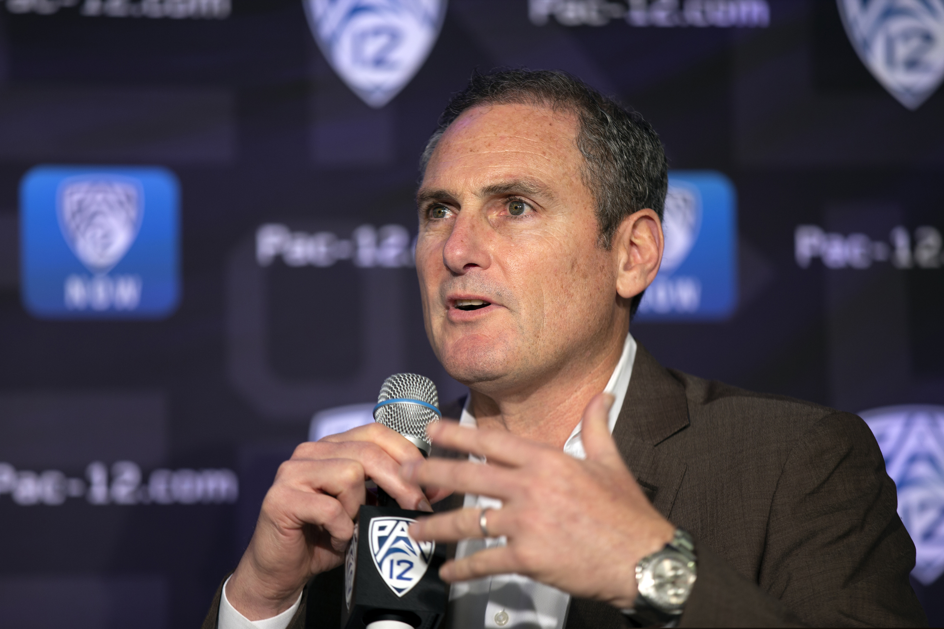 (D. Ross Cameron | AP) Pac-12 Commissioner Larry Scott speaks to reporters in San Francisco, Oct. 7, 2019.