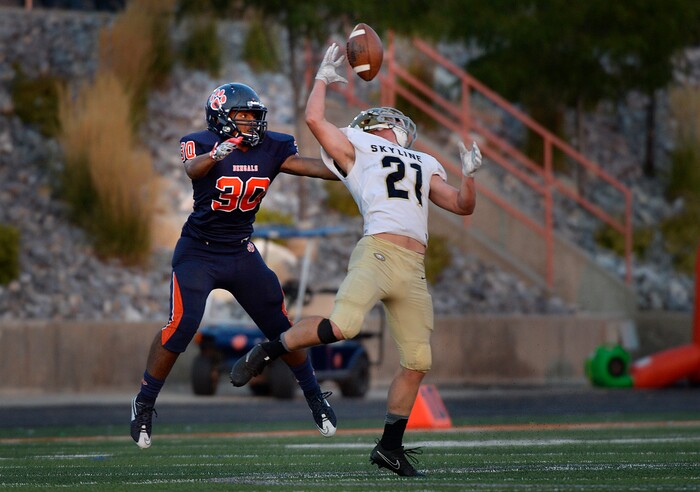 (Scott Sommerdorf   |  The Salt Lake Tribune)   
Skyline's Taylor Larsen makes a juggling catch of a Tommy McGrath pass during first half play in front of Brighton DB Kepu Fifita. Skyline held a 14-10 lead at the half over Brighton, Friday, September 15, 2017.