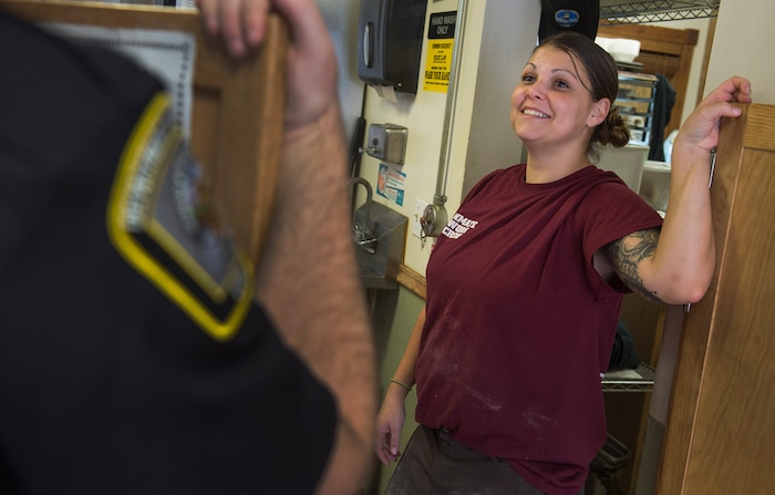 (Leah Hogsten  |  The Salt Lake Tribune) Chonsey Leslie shares a laugh with Department of Corrections officer Sgt. Trevor Kimmel. Every Monday through Friday, a half-dozen or so Level 4 inmates file out of the Olympus Facility at the Utah State Prison to cook, bake and serve the public at the Serving Time Caf. The operation is part of Utah Department of Corrections Industries (UCI) and is aimed at helping inmates return to society.