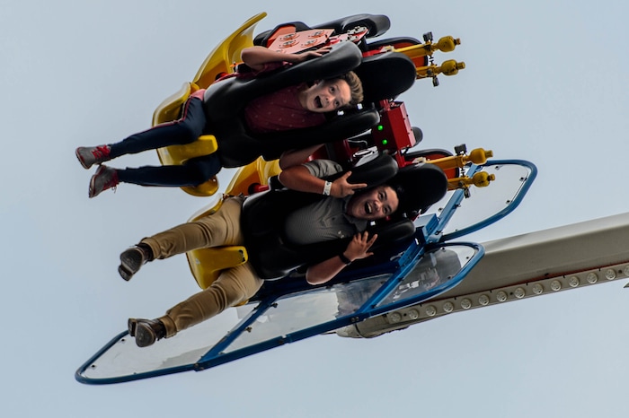 (Trent Nelson | The Salt Lake Tribune) Jesse Willes and Jared Taylor Shum on the carnival ride Speed at the Utah State Fair in Salt Lake City, Thursday September 7, 2017.