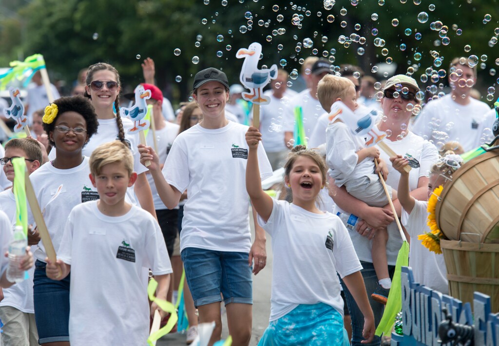 (Rick Egan  |  The Salt Lake Tribune)  Future missionaries walk in the Days of 47 Youth Parade, following a float with the theme "Building Faith Through Pioneer Stories".  Saturday, July 21, 2018.
