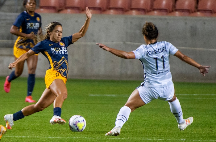 (Rick Egan | The Salt Lake Tribune) Utah Royals FC midfielder Lo'eau LaBonta (9) kicks the ball as Portland Thorns FC midfielder Rocky Rodrguez (11) defends, in soccer action between Utah Royals FC and Portland Thorns FC at Rio Tinto Stadium, on Saturday, Oct. 3, 2020.