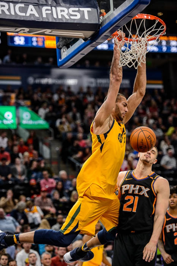 (Trent Nelson | The Salt Lake Tribune)  Utah Jazz center Rudy Gobert (27) dunks on Phoenix Suns center Alex Len (21) as the Utah Jazz host the Phoenix Suns, NBA basketball in Salt Lake City, Wednesday Feb. 14, 2018.