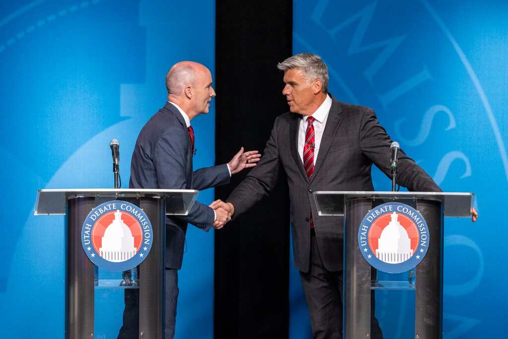 (Isaac Hale | Pool) Gov. Spencer Cox, left, shakes hands with Rep. Phil Lyman after a gubernatorial GOP primary debate held at the Eccles Broadcast Center in Salt Lake City on Tuesday, June 11, 2024.