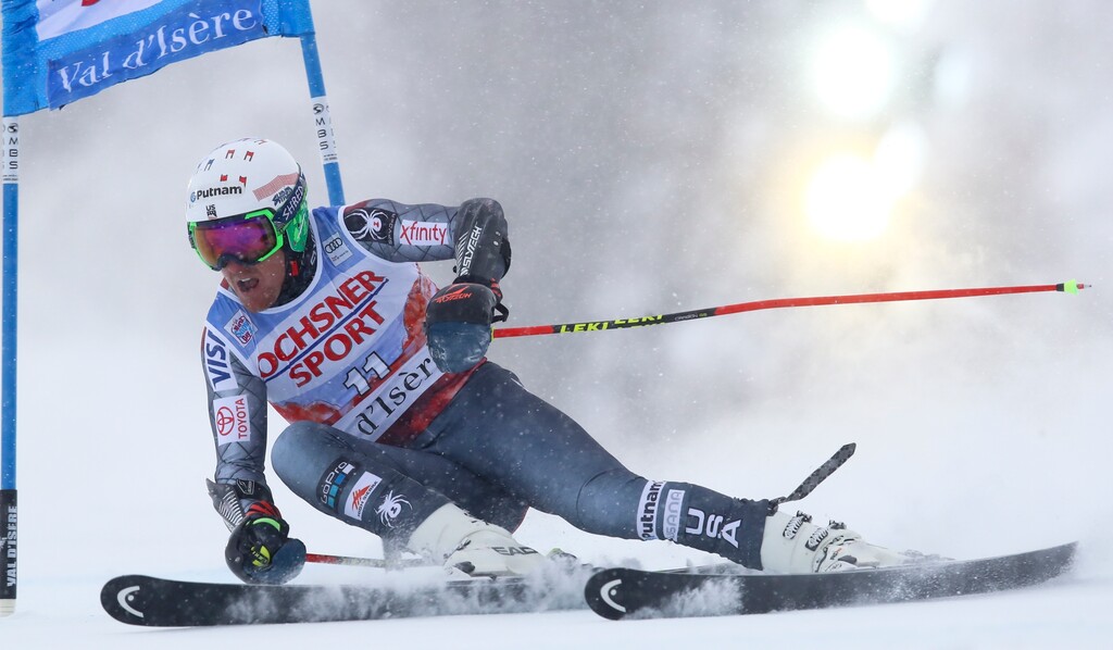 Ted Ligety of the United States speeds down the course during the first run of an alpine ski, men's World Cup giant slalom, in Val D'Isere, France, Saturday, Dec. 9, 2017. (AP Photo/Alessandro Trovati)