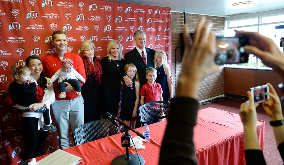 (Francisco Kjolseth  |  The Salt Lake Tribune)  University of Utah Athletics Director Chris Hill, at right is joined by family for a photo after announcing his plan to retire this spring after 31years. 