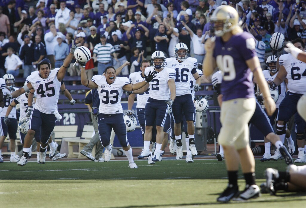BYU players (from left) Harvey Unga, Wayne Latu, Bryce Mahuika, and Blake Morgan celebrate as Washington's Danny Morovick walks off the field after BYU blocked a Washington point-after attempt in the fourth quarter of an NCAA college football game to give BYU a 28-27 win, Saturday, Sept. 6, 2008, at Husky Stadium in Seattle.  (AP Photo/Ted S. Warren)