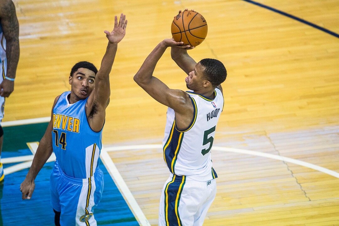 Chris Detrick  |  The Salt Lake TribuneUtah Jazz guard Rodney Hood (5) shoots past Denver Nuggets guard Gary Harris (14) during the game at Vivint Smart Home Arena Friday December 18, 2015.  Utah Jazz defeated Denver Nuggets 97-88.
