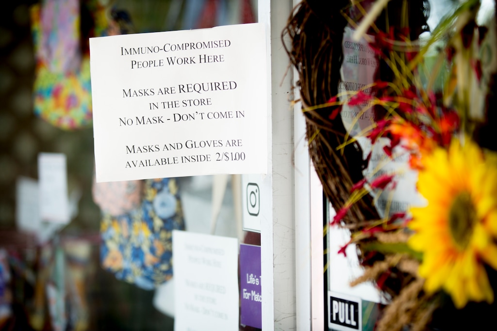 A face mask notice is displayed outside of a business in downtown Provo, Utah, on Thursday, Aug. 27, 2020. (Isaac Hale/The Daily Herald via AP)