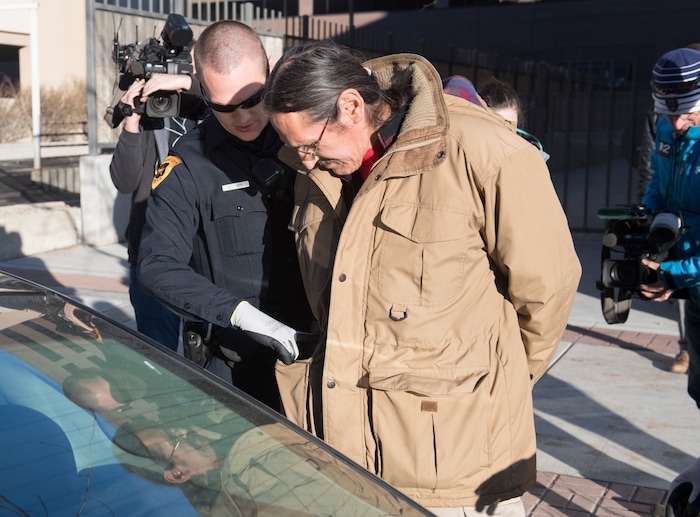 (Rick Egan  |  The Salt Lake Tribune)  Jackie Sanchez is searched by the Salt Lake City Police in front of a half dozen tv cameras as he is arrested by Salt Lake City police, after a media conference in his attorney's office about the abuse of force claim that is being filed against the Salt Lake City Police, after Sanchez was attacked by a police dog on July 28. Wednesday, December 6, 2017.



