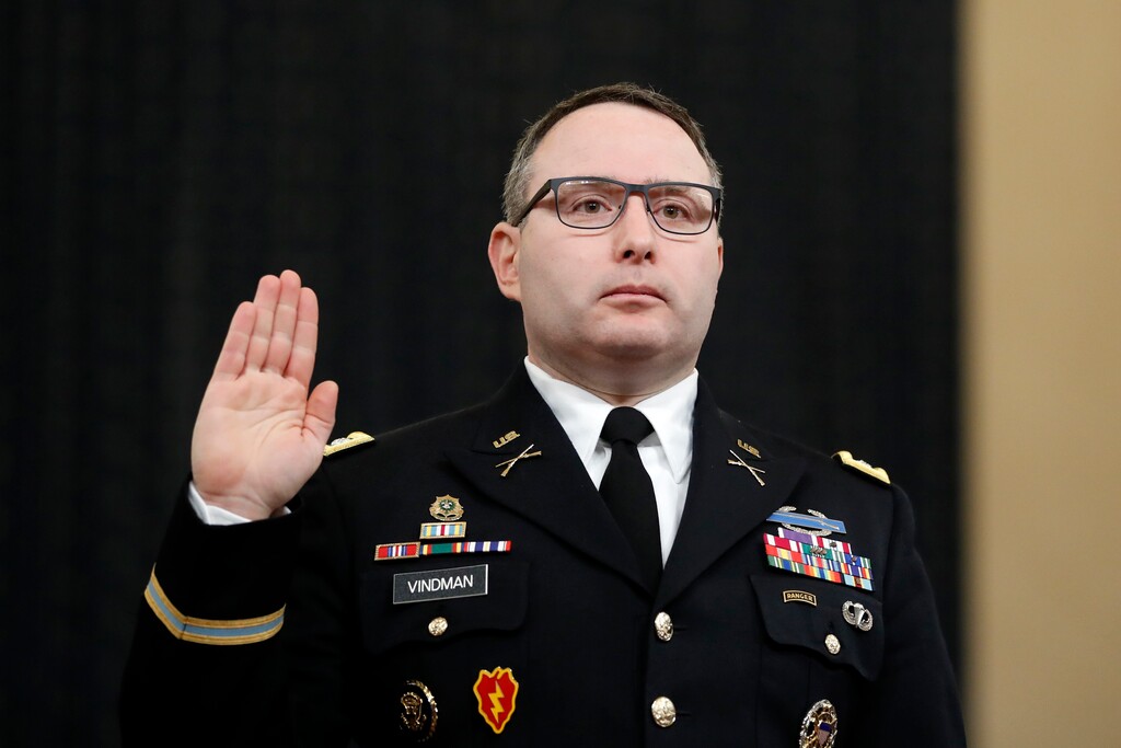 National Security Council aide Lt. Col. Alexander Vindman is sworn in to testify before the House Intelligence Committee on Capitol Hill in Washington, Tuesday, Nov. 19, 2019, during a public impeachment hearing of President Donald Trump's efforts to tie U.S. aid for Ukraine to investigations of his political opponents. (AP Photo/Andrew Harnik)