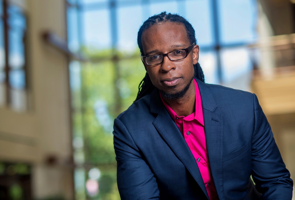 In this undated photo provided by American University, Ibram X. Kendi, author of "Antiracist Baby," poses for a portrait. After a week of riots and looting over the loss of George Floyd, the Minneapolis black man who died after a police officer pressed his knee into his neck for more than eight minutes as he pleaded for air, parents are struggling to have the talk in this volatile moment, along with many others around race and racism. (Jeff Watts/American University via AP)