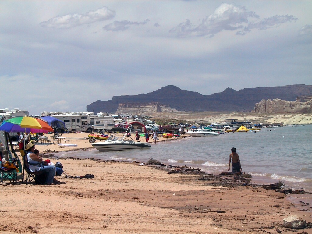 (Tribune file photo) Crowds gather at Lone Rock Beach at Lake Powell on May 29, 2005.
