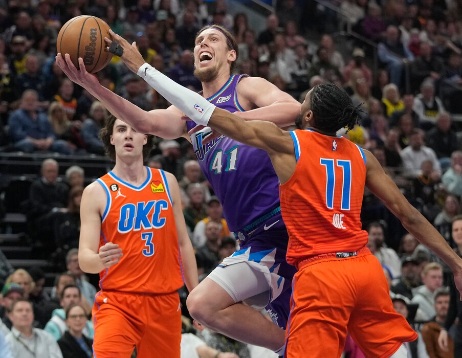 (Leah Hogsten | The Salt Lake Tribune) Utah Jazz forward Kelly Olynyk (41) shoots around Oklahoma City Thunder guard Isaiah Joe (11) as the Utah Jazz host the Oklahoma Thunder at Vivint Arena Thursday, April 6, 2023.
