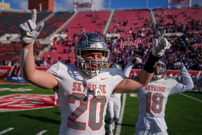 (Trent Nelson  |  The Salt Lake Tribune) Skyridge's Carter Sheffield (20) and Skyridge's Porter Logan (18) celebrate their win over Corner Canyon in the 6A high school football championship game at Rice-Eccles Stadium in Salt Lake City on Friday, Nov. 18, 2022.