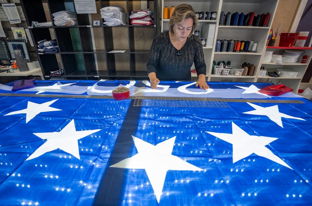 (Rick Egan | The Salt Lake Tribune) Erika Sepulveda makes one of the limited edition flags for the United States 250th anniversary at Colonial Flag in Sandy on Monday, June 1, 2026.