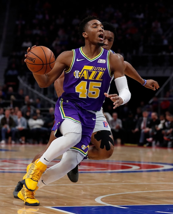 Utah Jazz guard Donovan Mitchell (45) drives during the first half of an NBA basketball game against the Detroit Pistons, Saturday, Jan. 5, 2019, in Detroit. (AP Photo/Carlos Osorio)