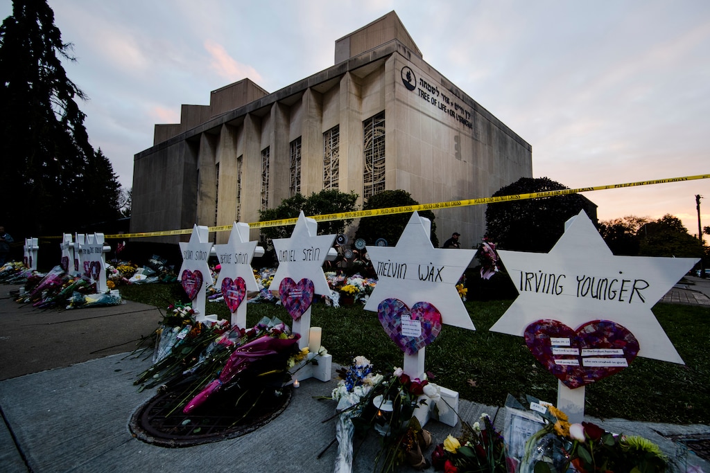 (AP Photo/Matt Rourke, File) In this Oct. 29, 2018, file photo, a makeshift memorial stands outside the Tree of Life synagogue in the aftermath of a deadly shooting at the in Pittsburgh. A team of rabbis and volunteers has gone into the Tree of Life synagogue to gather up blood and other remains from the victims of the shooting rampage, in keeping with Jewish law that says the entire body must be buried.