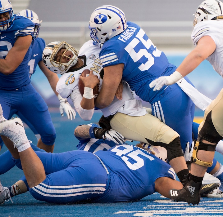 (Jeremy Harmon  |  The Salt Lake Tribune) Western Michigan Broncos quarterback Kaleb Eleby (9) is sacked by Brigham Young Cougars defensive lineman Lorenzo Fauatea (55) as BYU faces the Western Michigan Broncos in the Famous Idaho Potato Bowl in Boise, Idaho, on Friday, Dec. 21, 2018.